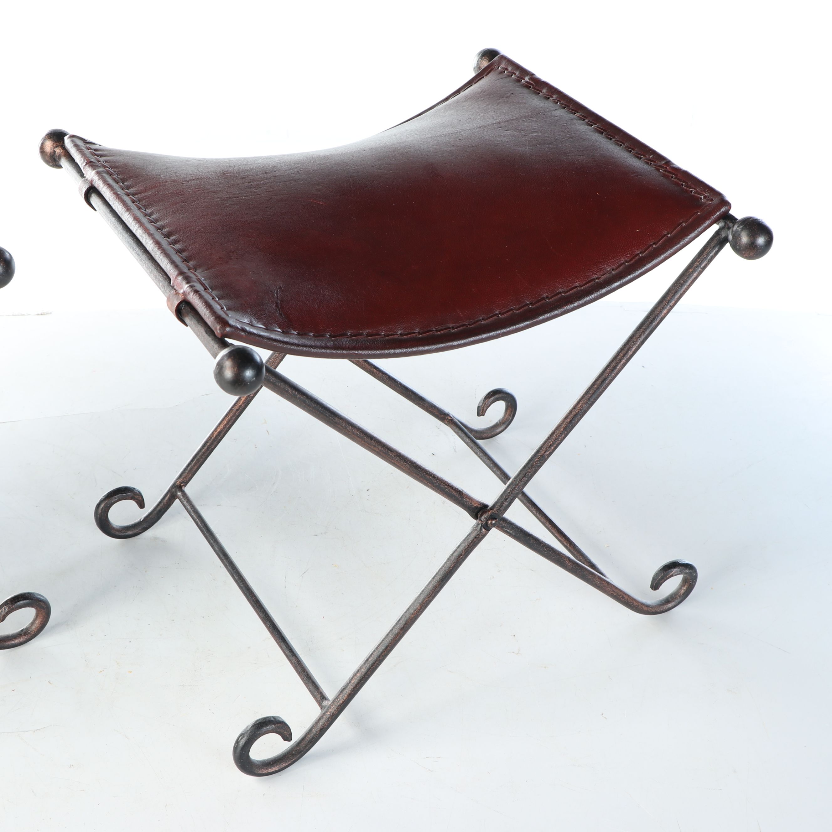 Rustic Padded Leather Footstools with Scrolled Folding Metal Frames