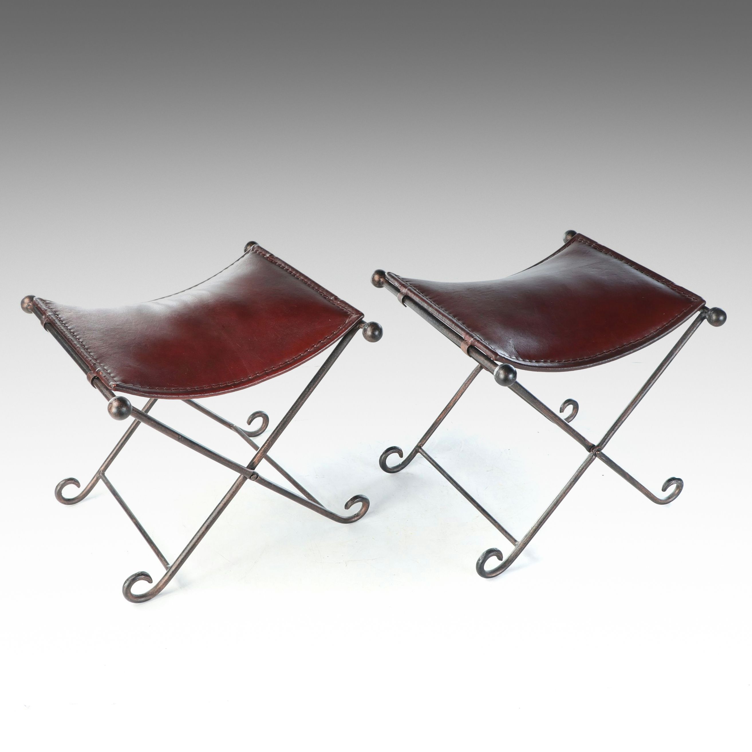 Rustic Padded Leather Footstools with Scrolled Folding Metal Frames