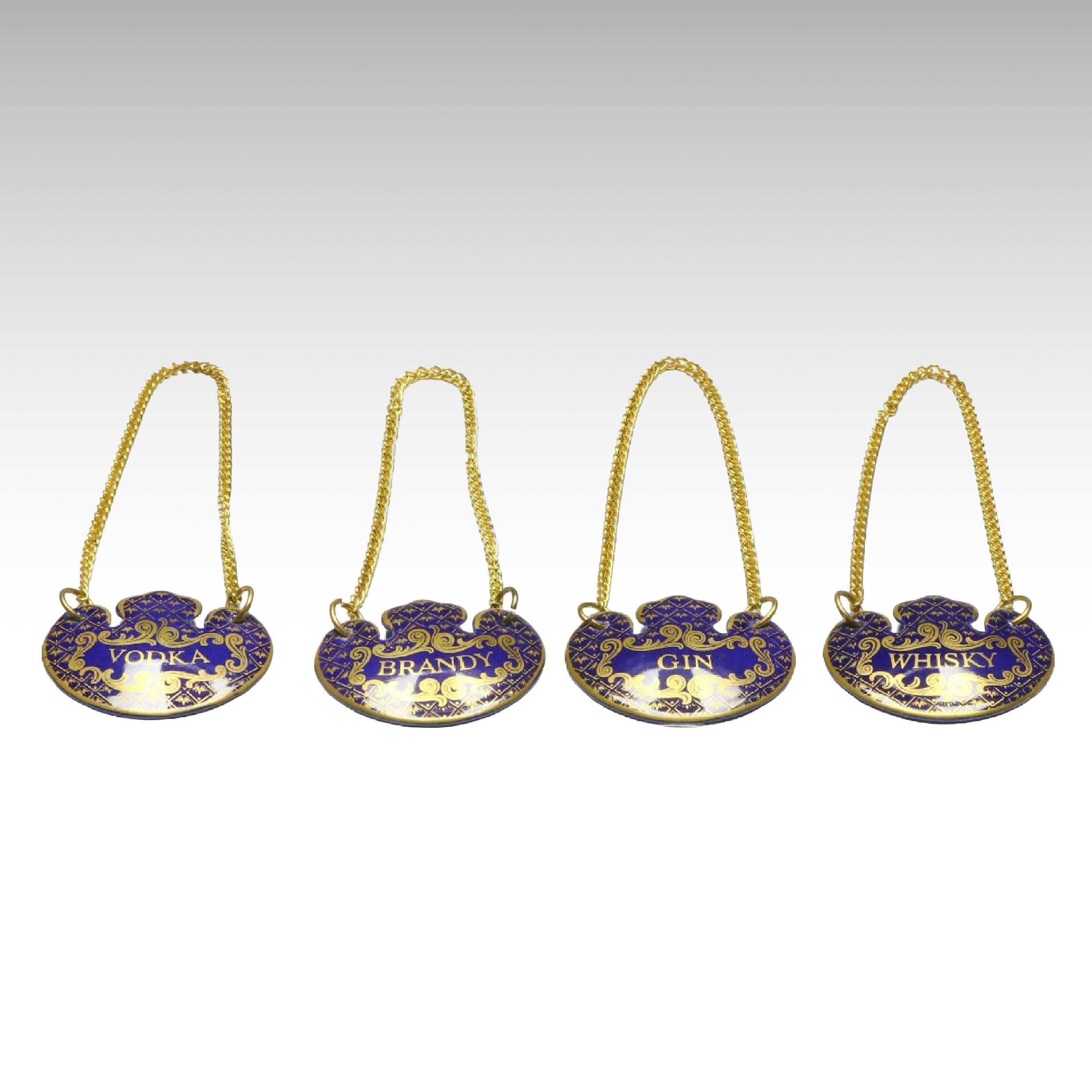 Halcyon Days Cobalt and Gilt Enamel Liquor Tags, Late 20th Century