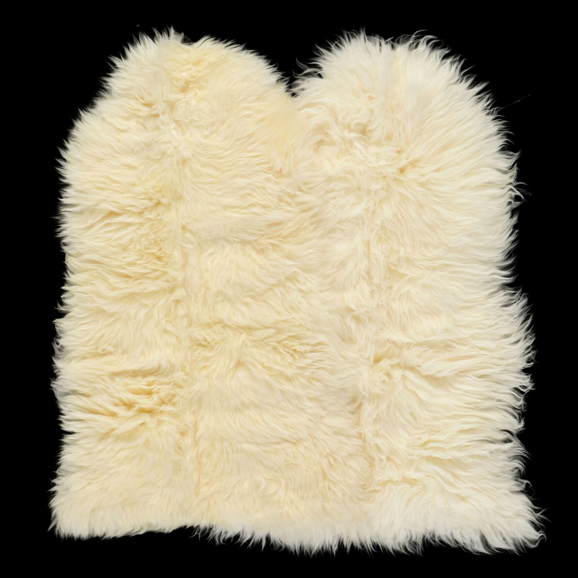 Pair of Cream Colored Sheepskin Accent Rugs