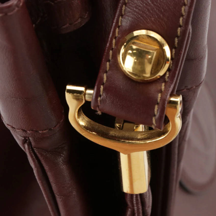 Cartier Must de Cartier Small Drawstring Bucket Bag in Burgundy Leather ...