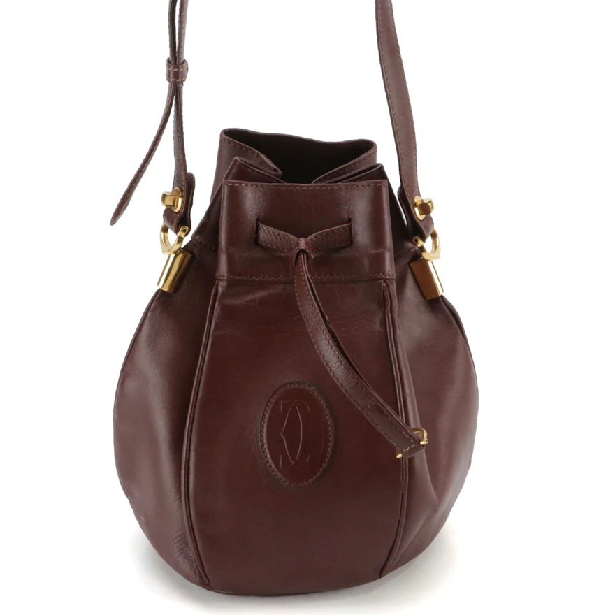 Cartier Must de Cartier Small Drawstring Bucket Bag in Burgundy Leather ...