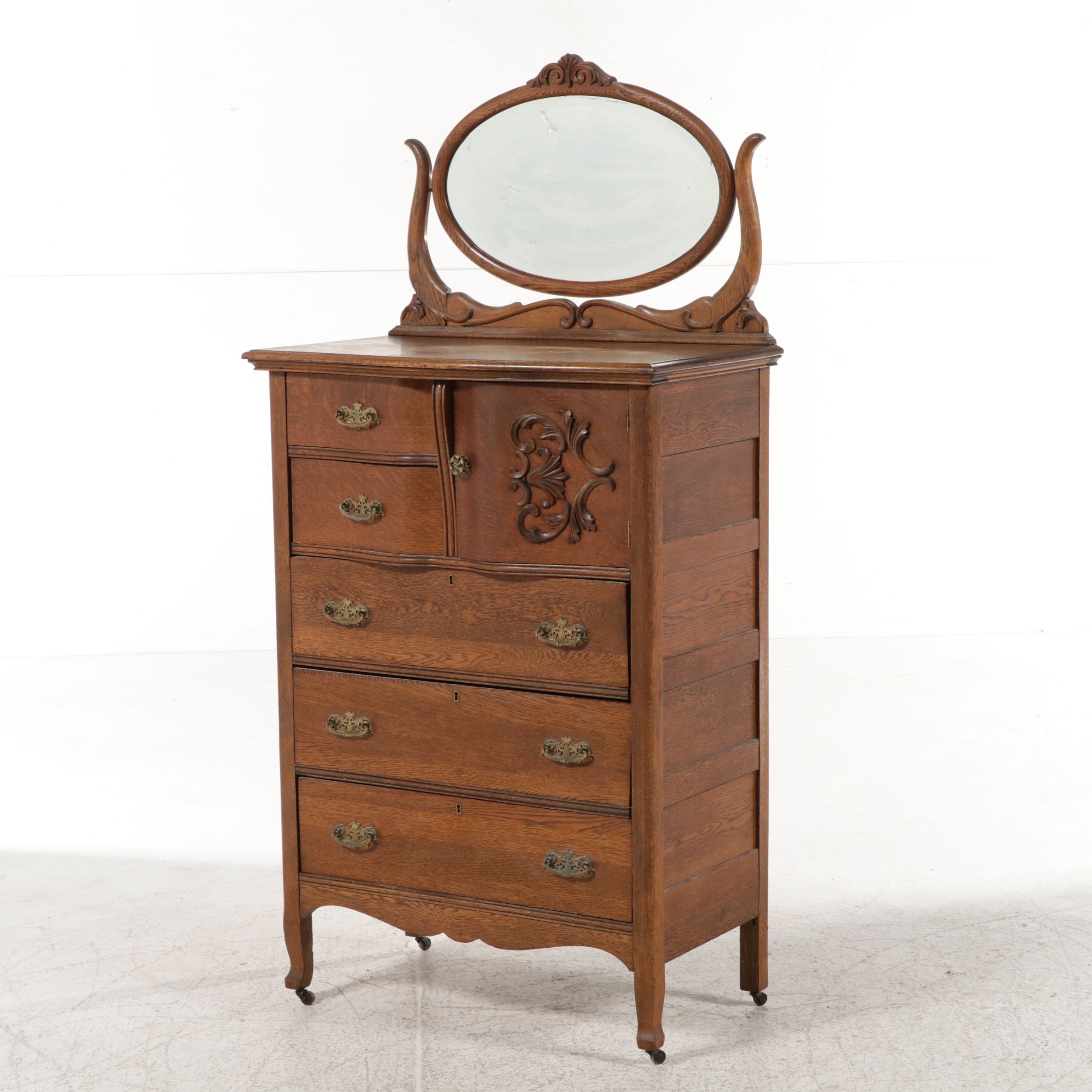 Edwardian Carved Tiger Oak Highboy Dresser with Swivel Mirror, Early 20th C.