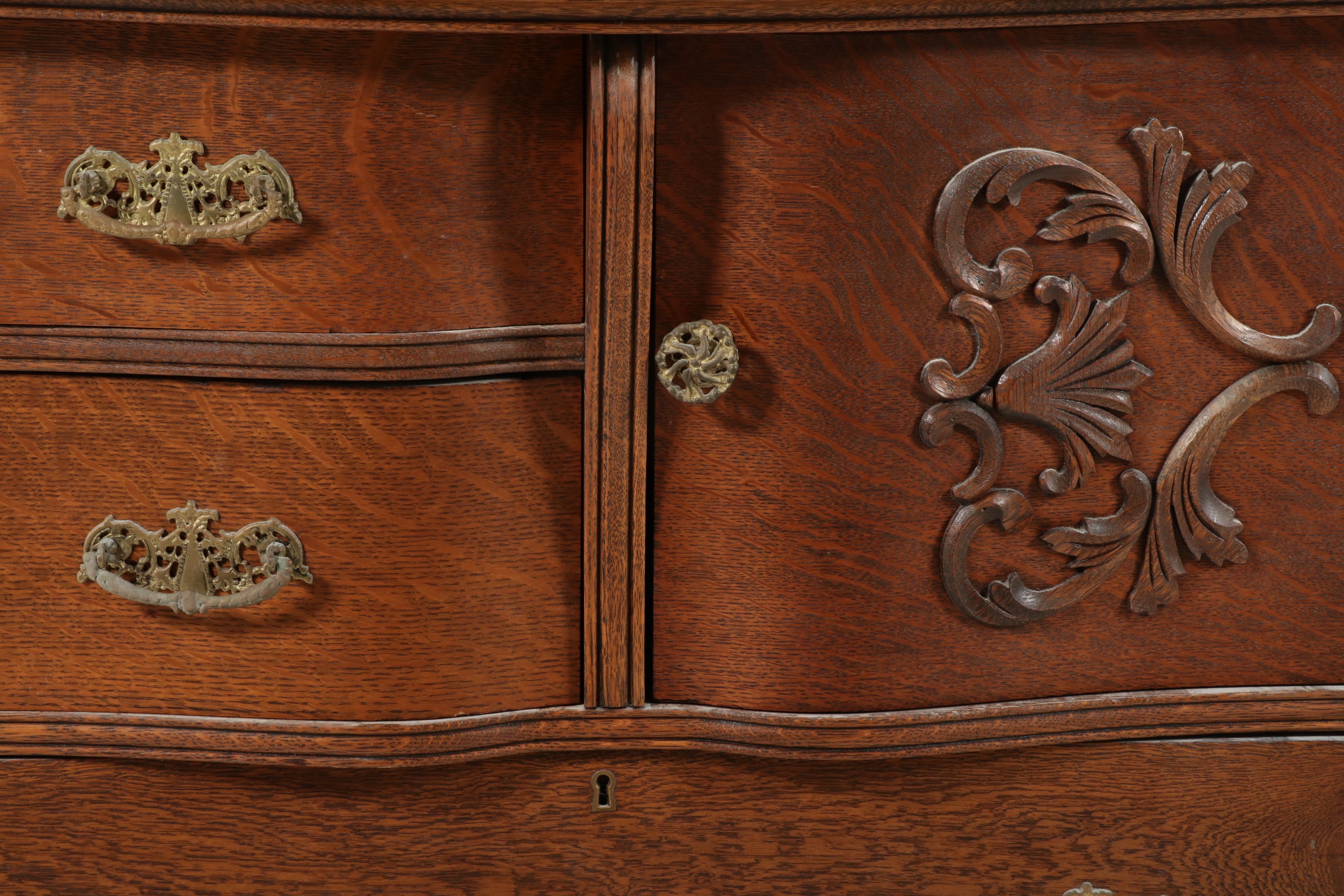 Edwardian Carved Tiger Oak Highboy Dresser with Swivel Mirror, Early 20th C.