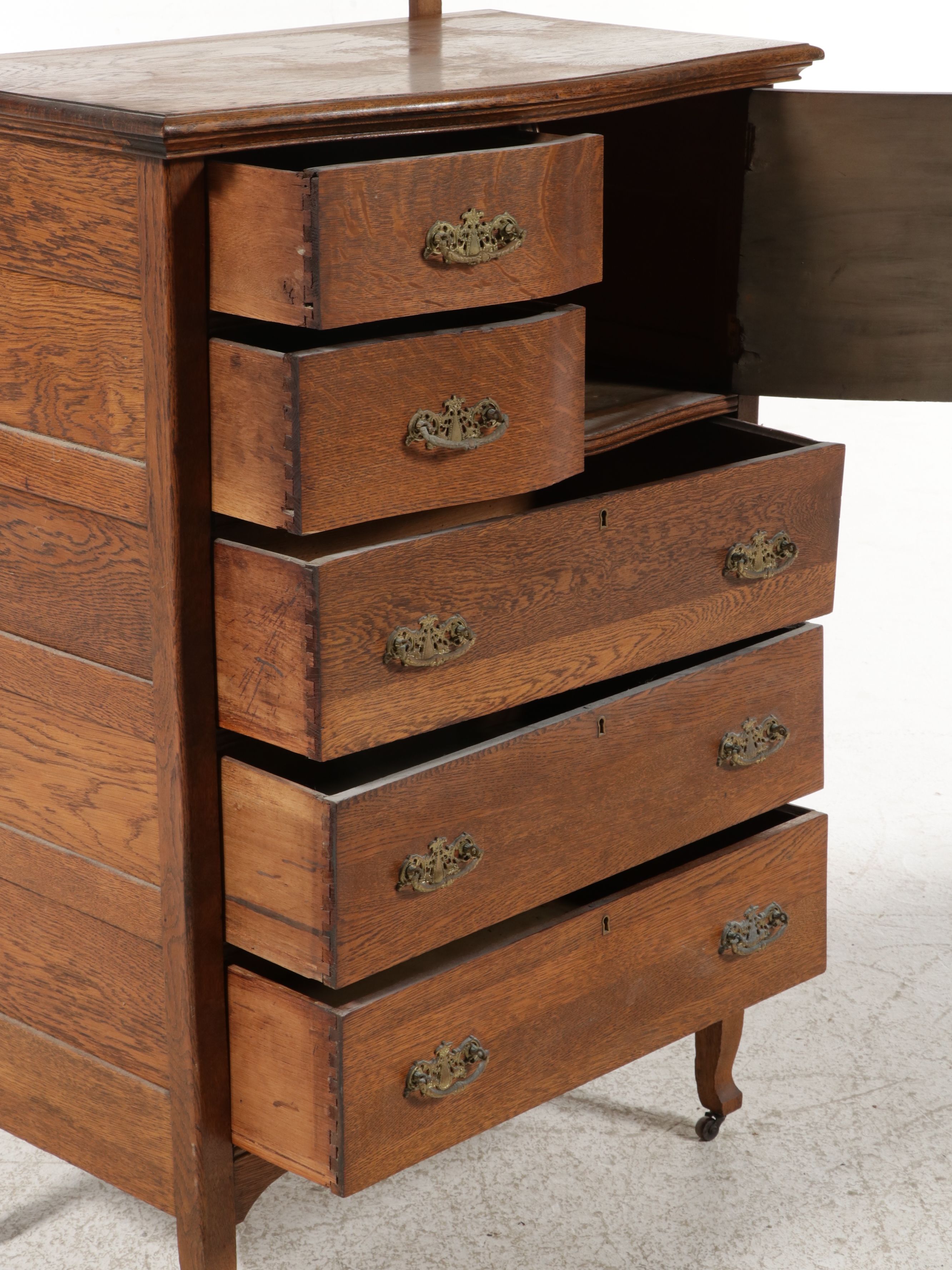 Edwardian Carved Tiger Oak Highboy Dresser with Swivel Mirror, Early 20th C.