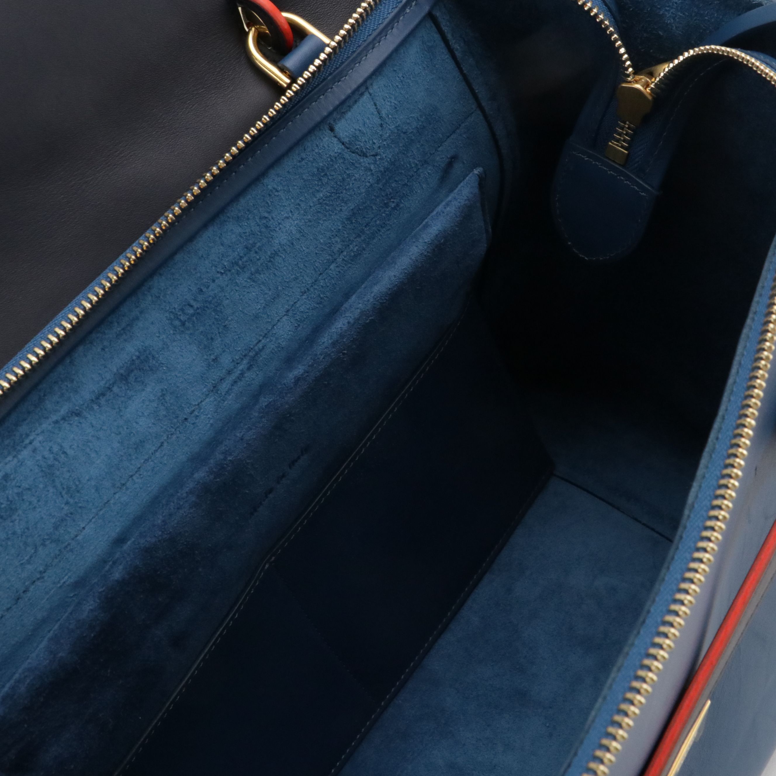 GEMINI: Céline Belt Two-Way Bag in Navy & Marine Blue Leather with Red Trim
