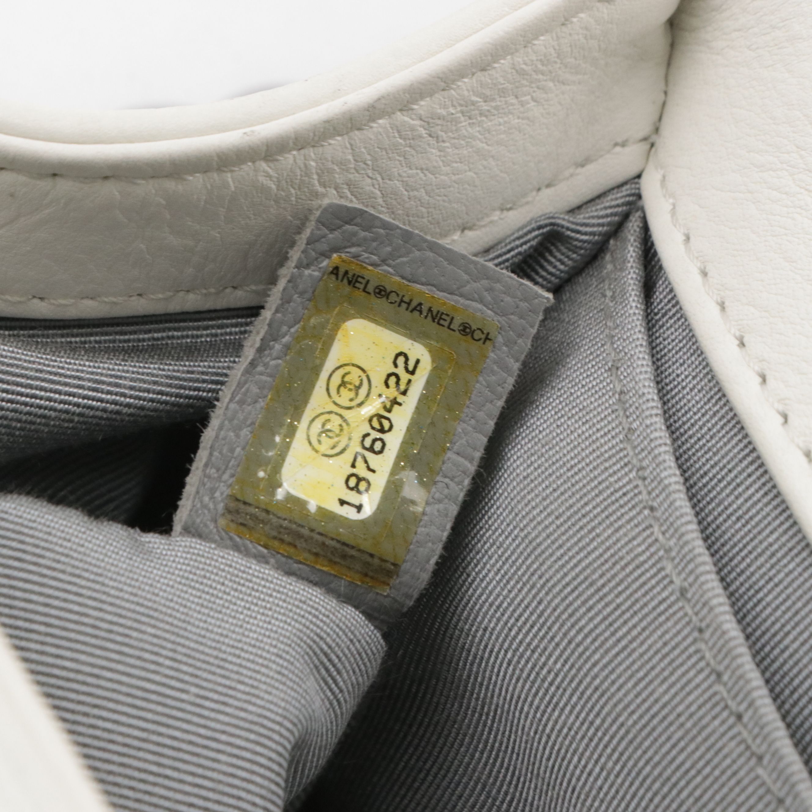 TAURUS: Chanel Boy Flap Bag in White Matelassé Grained Leather