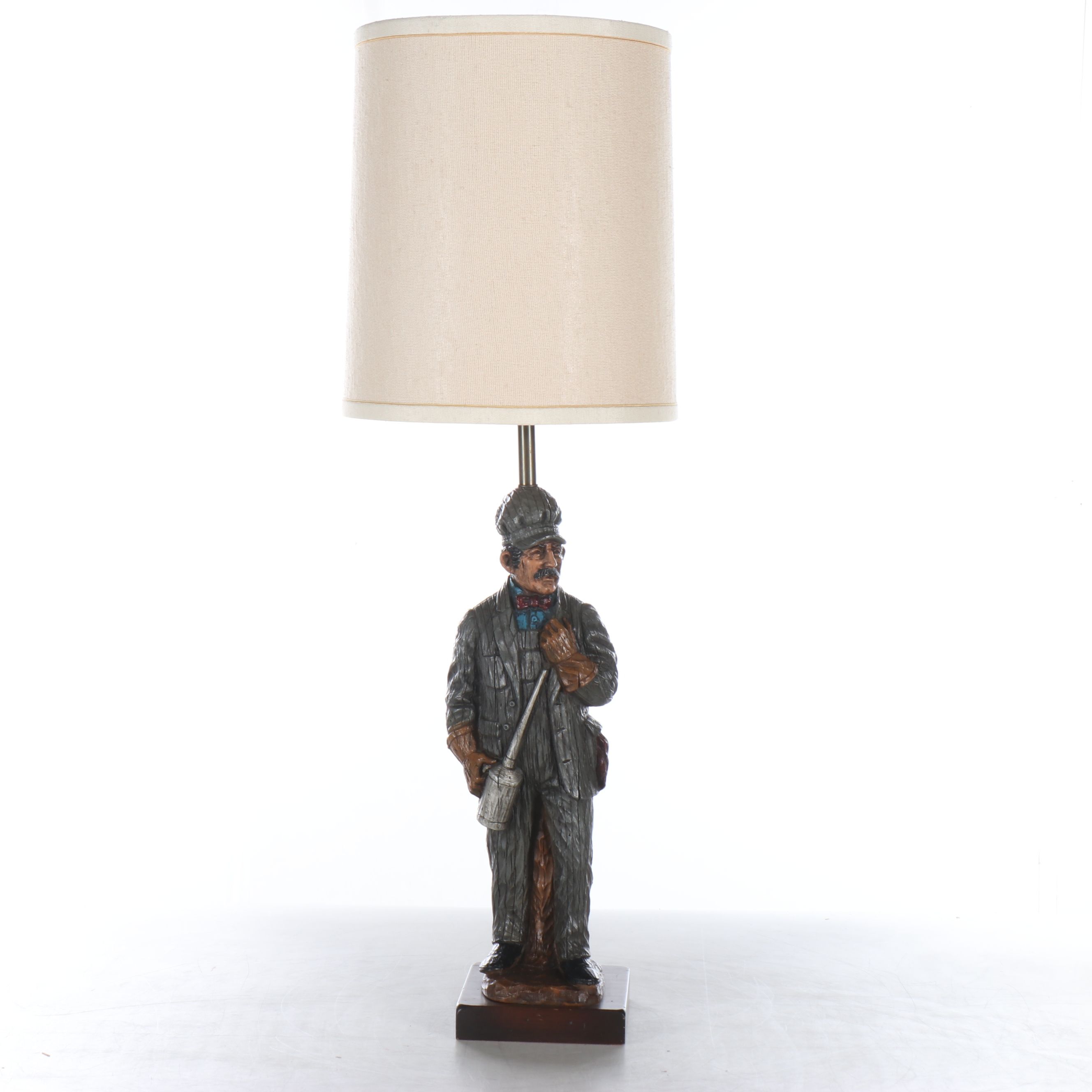 Carved Resin Train Conductor Table Lamp