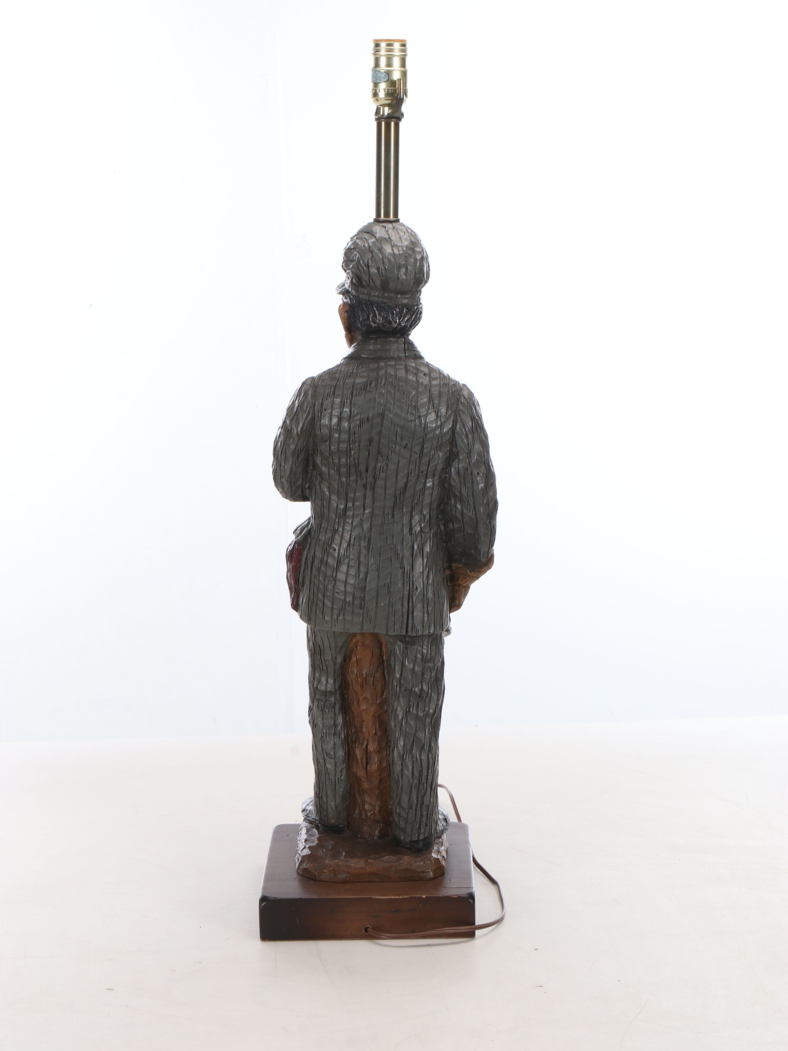 Carved Resin Train Conductor Table Lamp