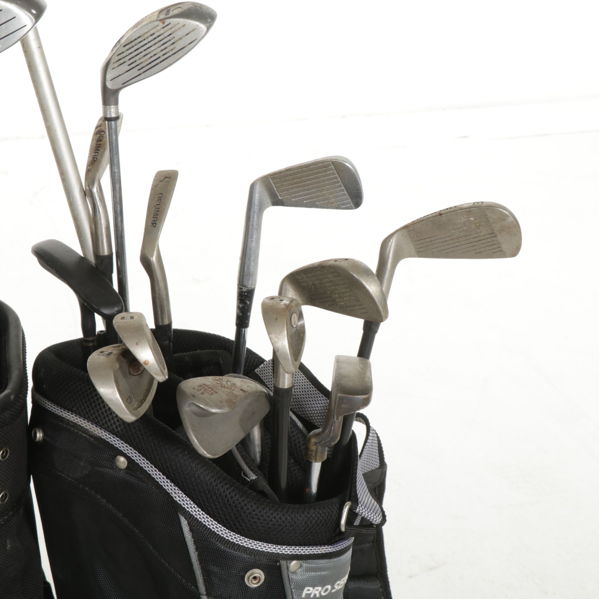 Two Golf Bags Including a Rival Titanium Reinforced 1-Driver and More Golf Clubs