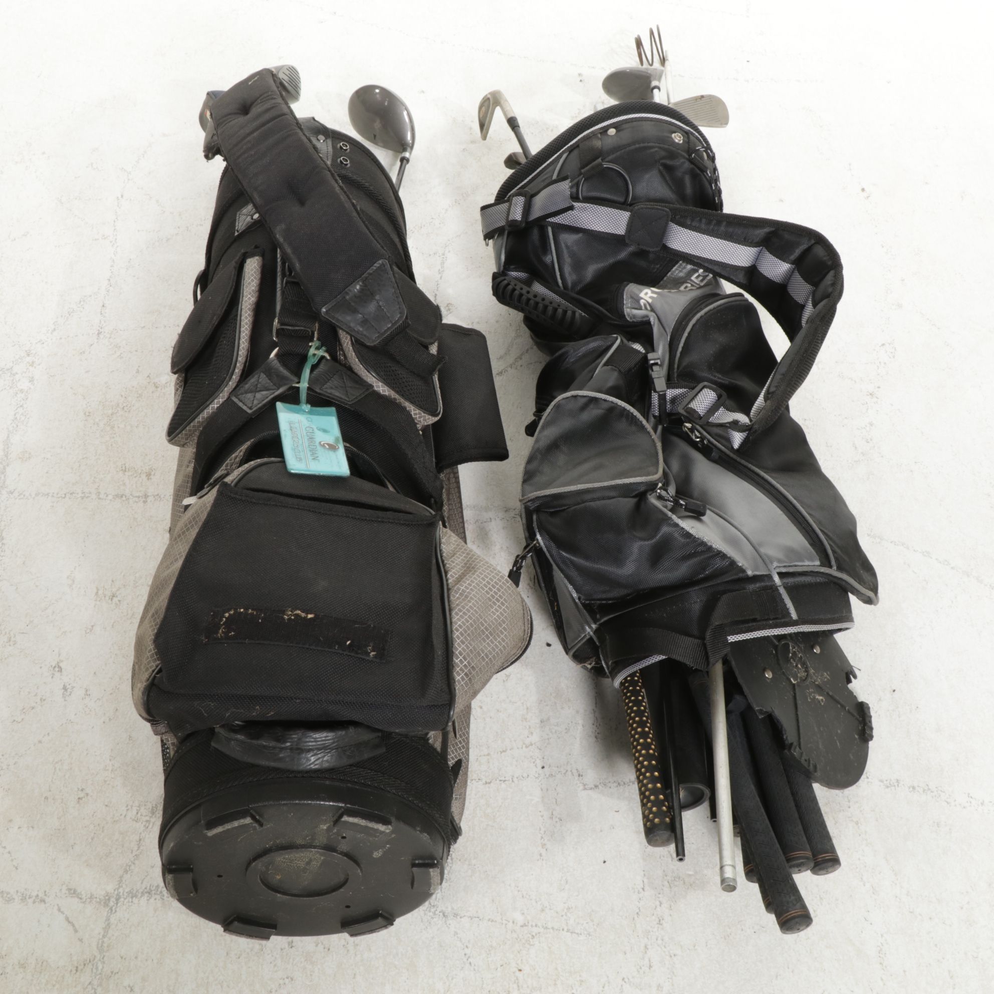 Two Golf Bags Including a Rival Titanium Reinforced 1-Driver and More Golf Clubs