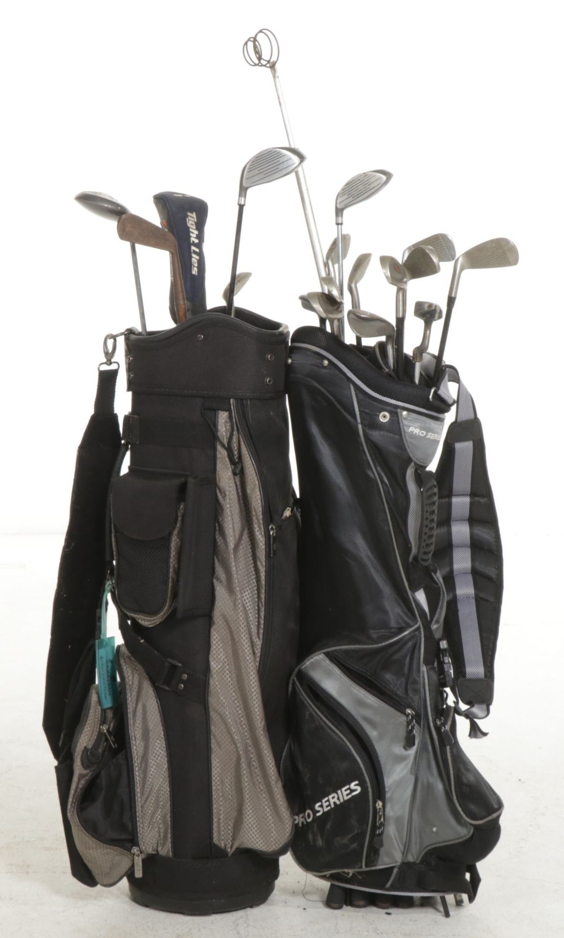 Two Golf Bags Including a Rival Titanium Reinforced 1-Driver and More Golf Clubs