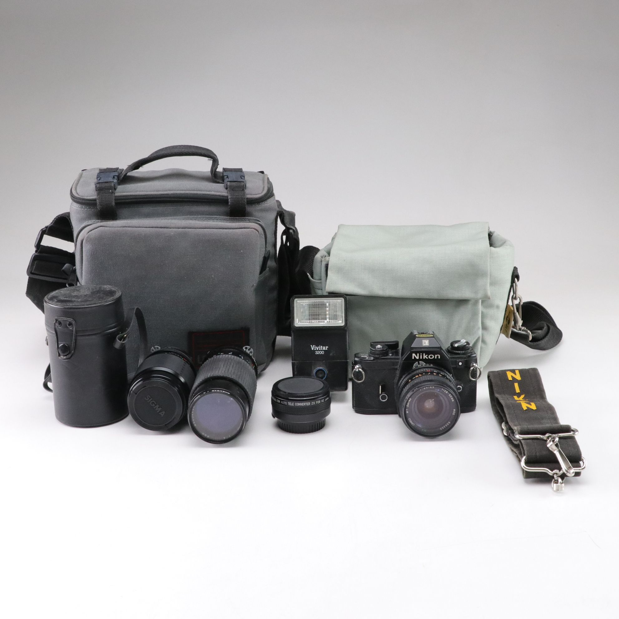 Nikon EM 35mm Film Camera with Lenses and More