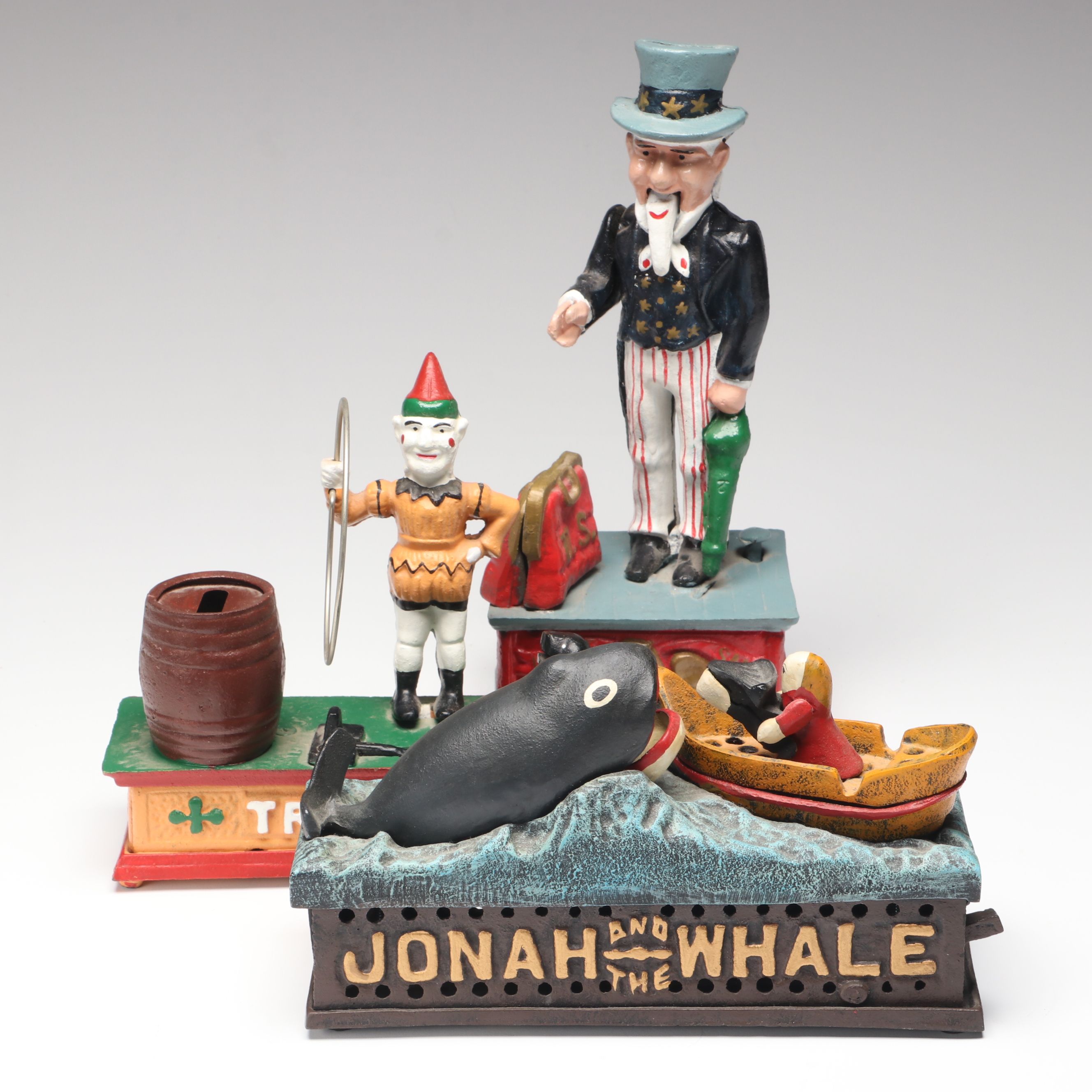 "Jonah and the Whale," "Uncle Sam" and "Trick Dog" Cast Iron Coin Banks