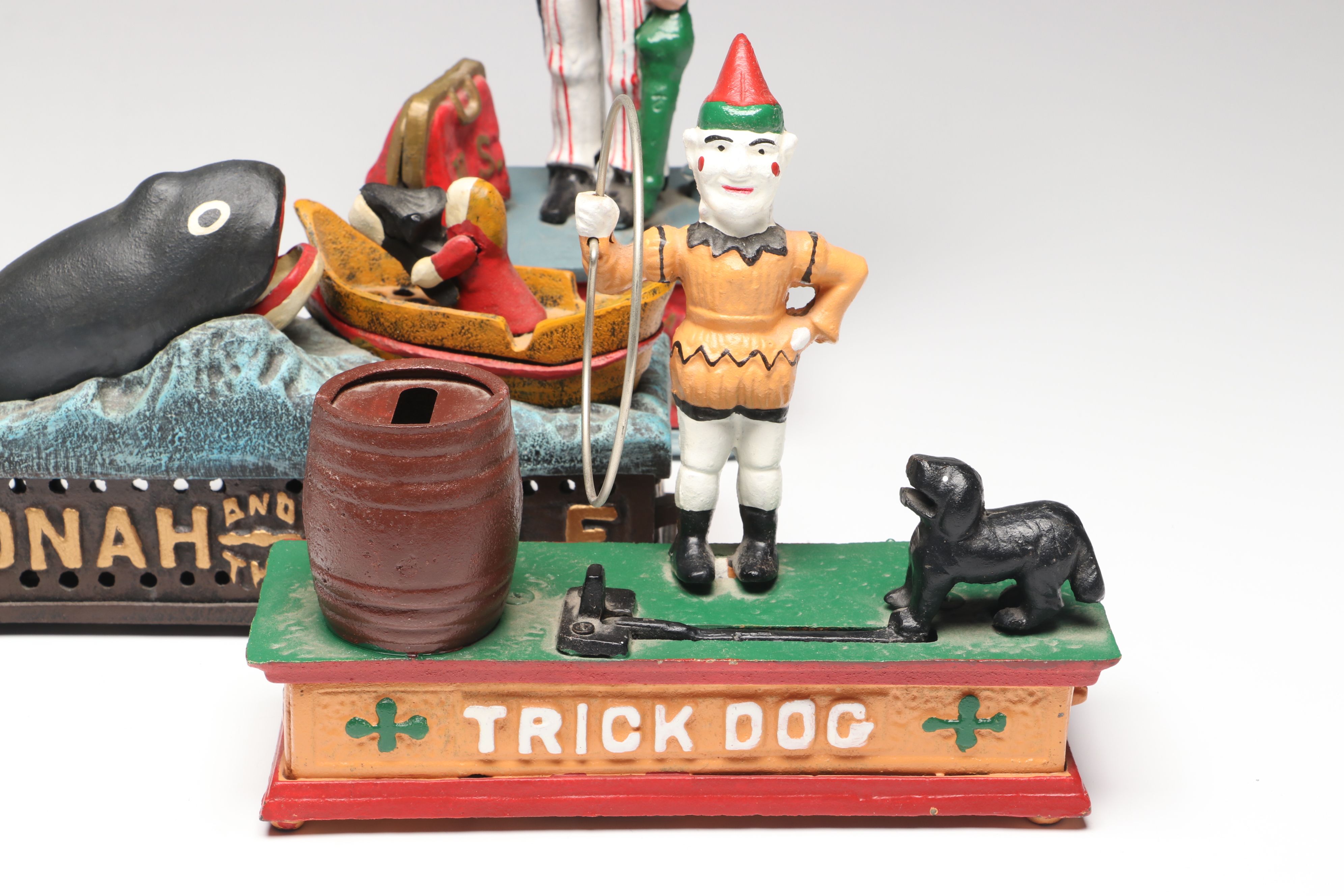 "Jonah and the Whale," "Uncle Sam" and "Trick Dog" Cast Iron Coin Banks