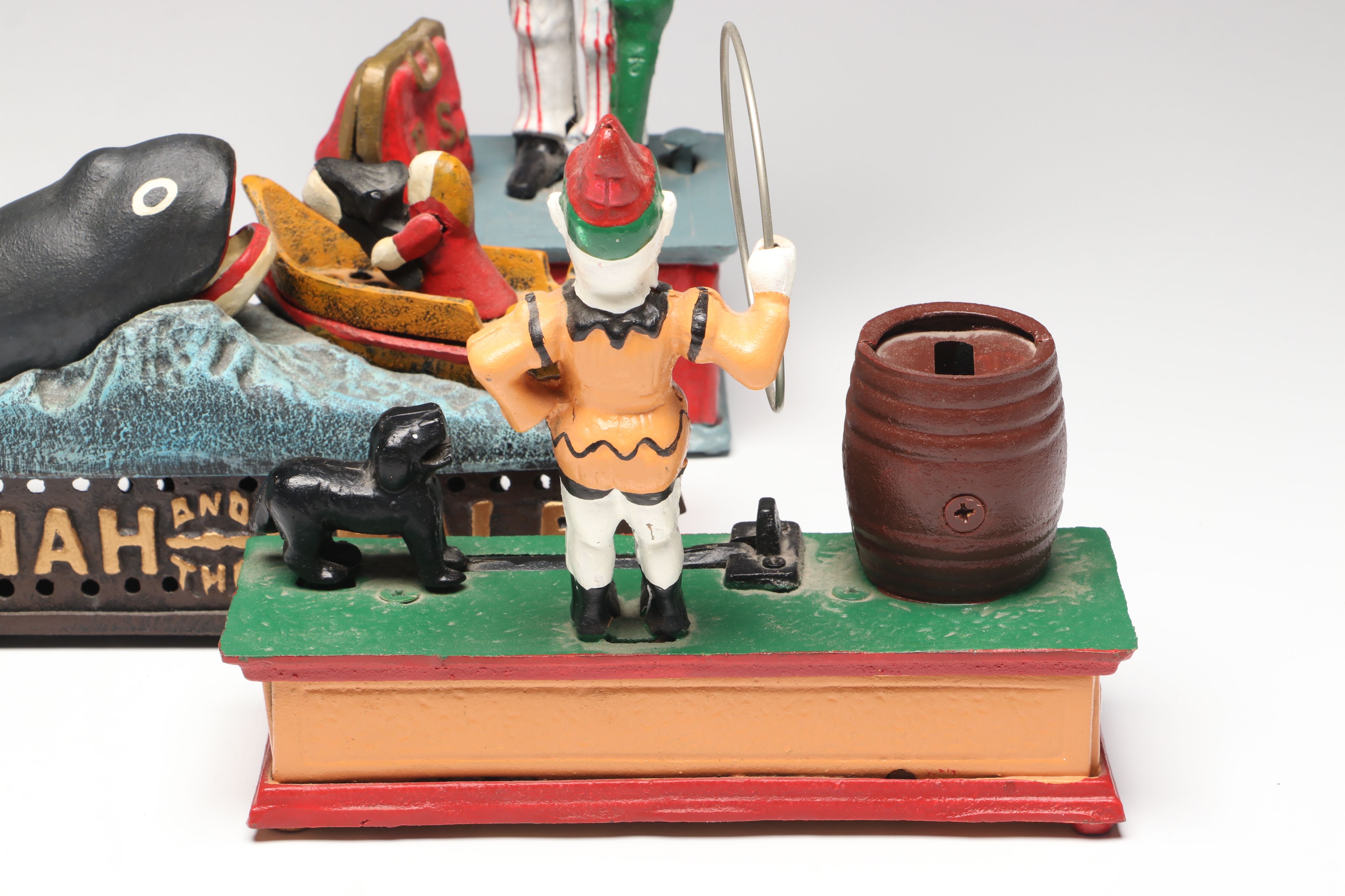 "Jonah and the Whale," "Uncle Sam" and "Trick Dog" Cast Iron Coin Banks