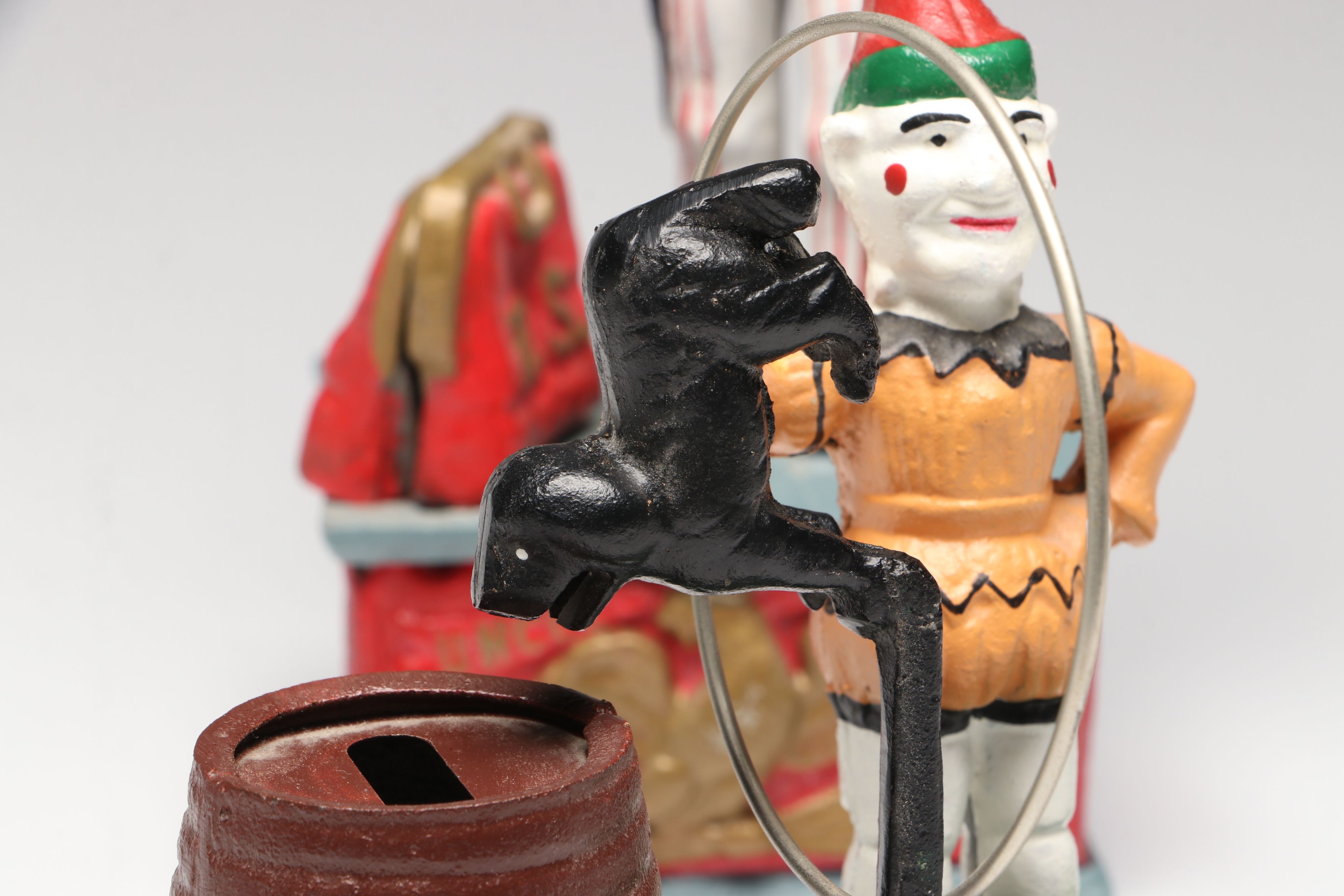 "Jonah and the Whale," "Uncle Sam" and "Trick Dog" Cast Iron Coin Banks