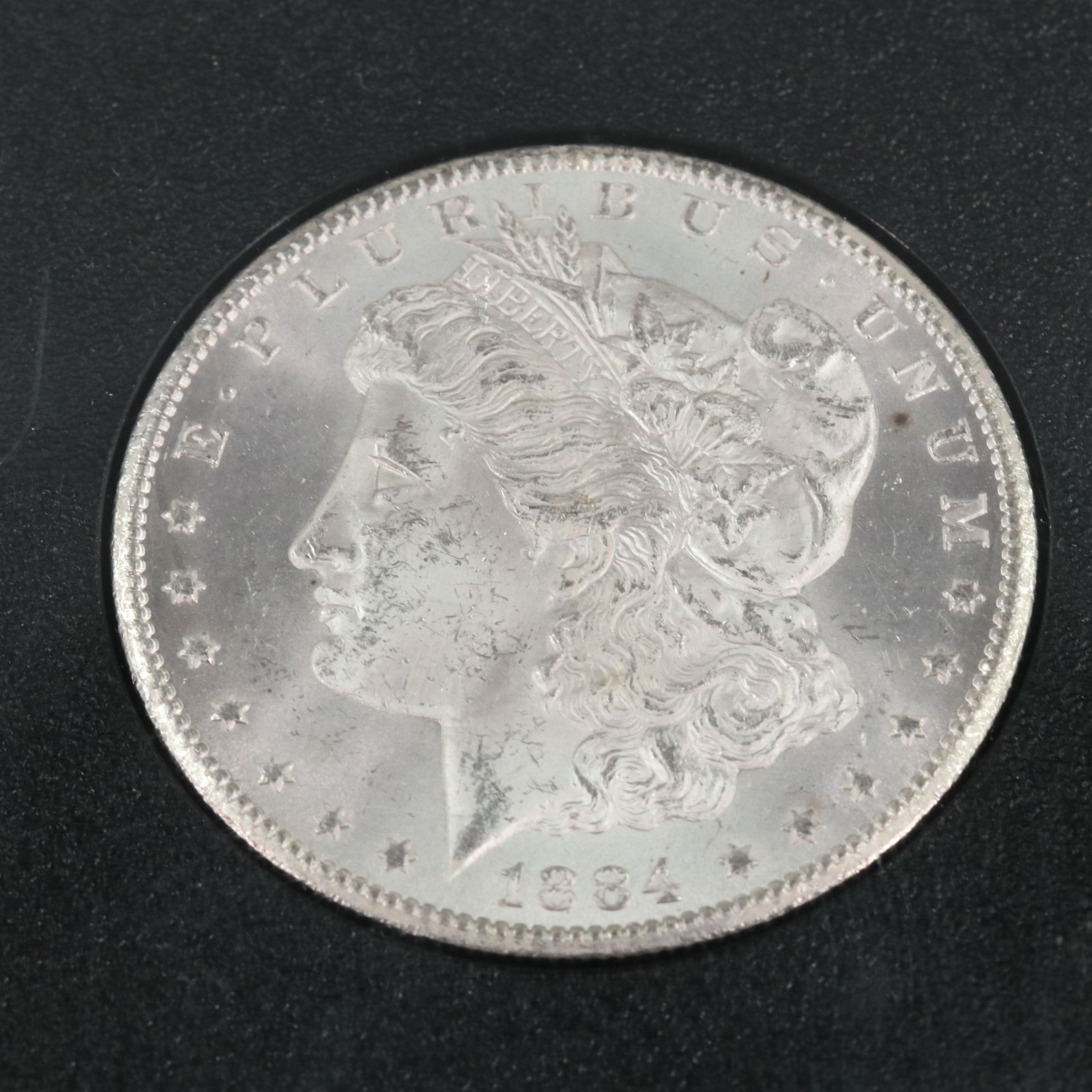 1884-CC Morgan Silver Dollar in a GSA Holder