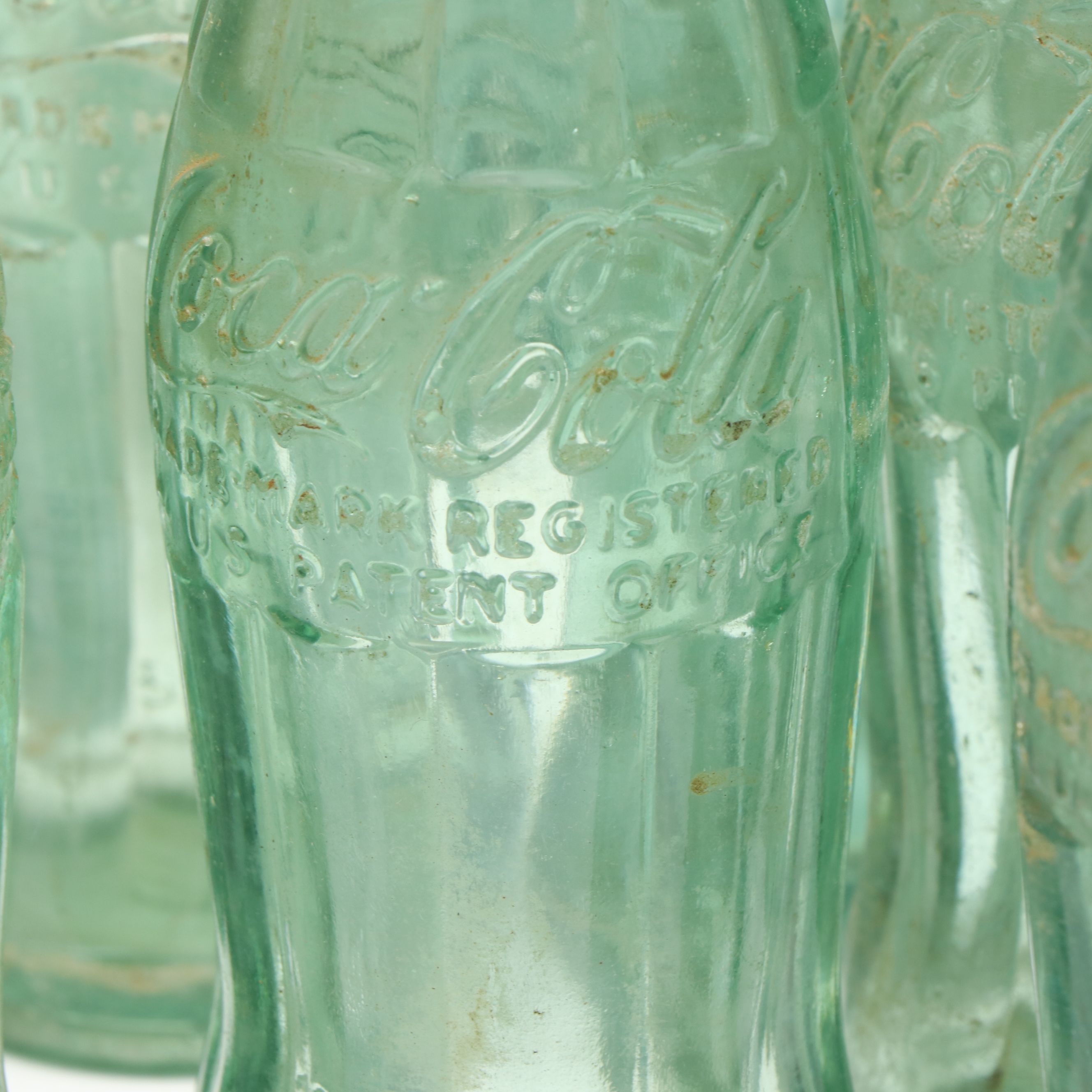 Glass Coca-Cola Hobbleskirt Bottles, Early to Mid-20th C.