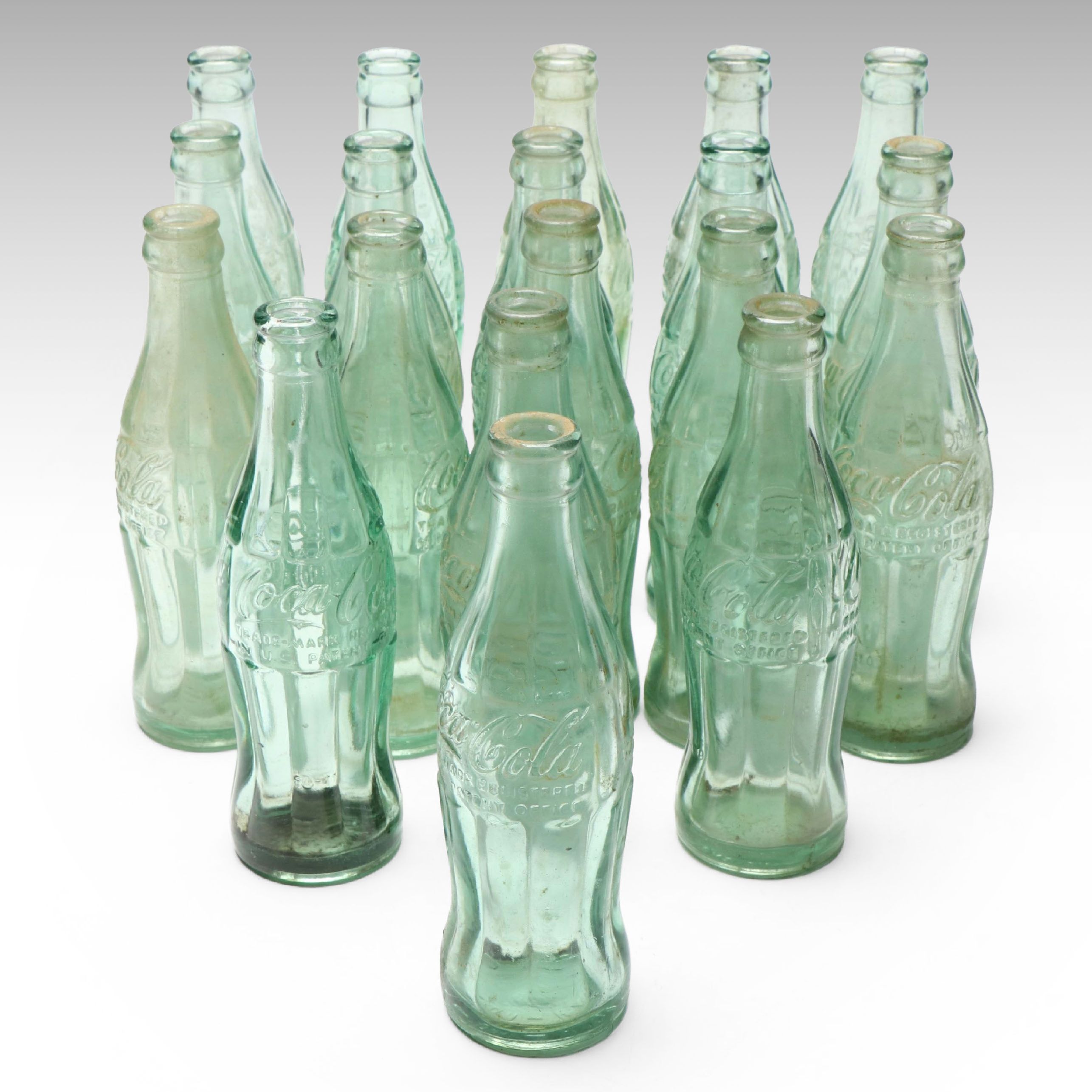 Glass Coca-Cola Hobbleskirt Bottles, Early to Mid-20th C.