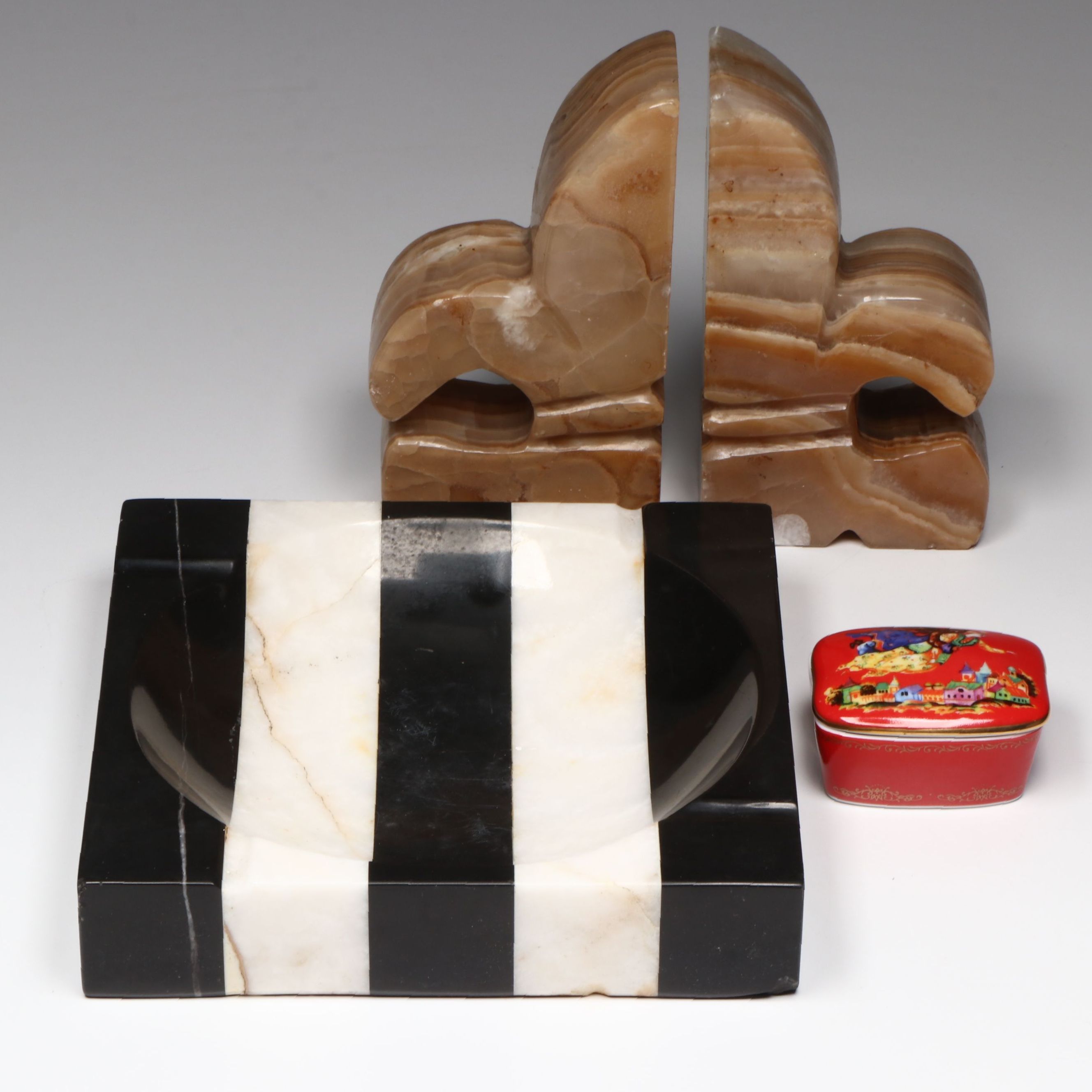 Striped Marble Ashtray, Fleur-de-Lis Onyx Bookends and Porcelain Music Box