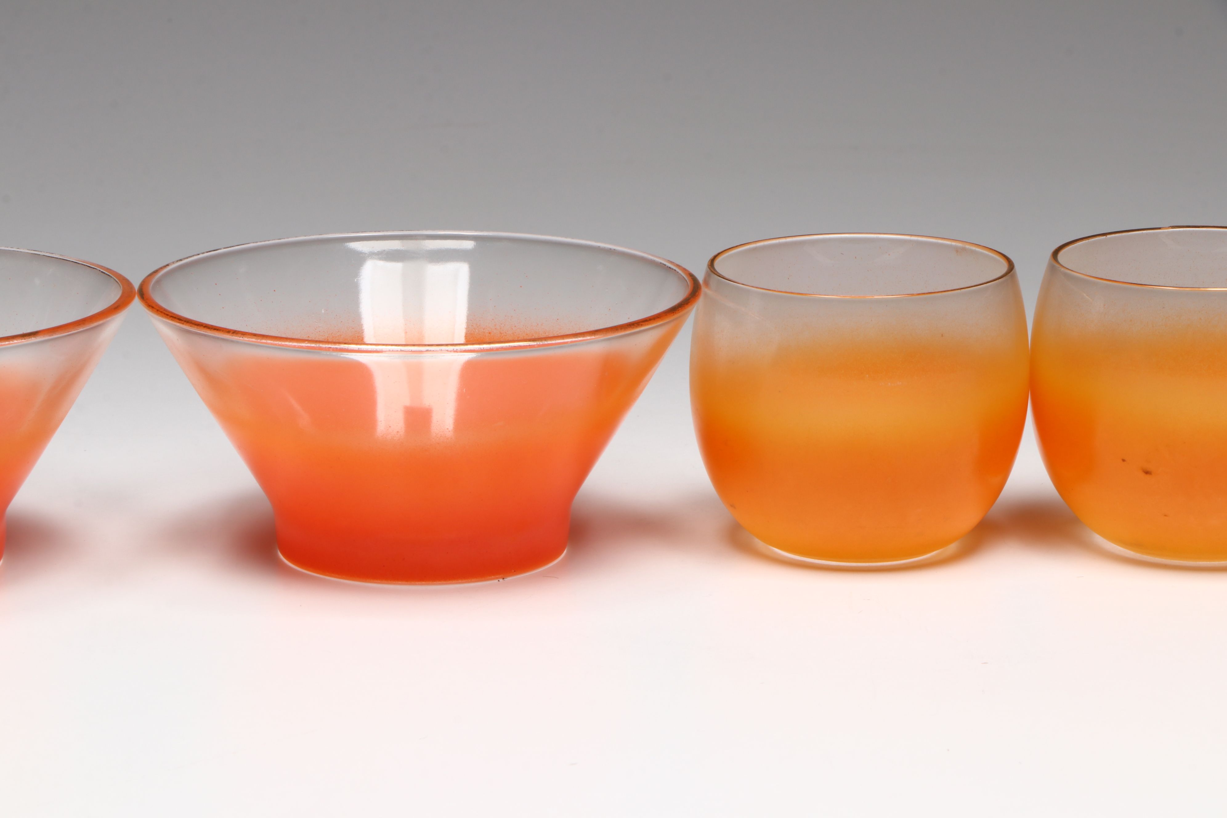Mid Century Modern Orange Glass Bowls with Cocktail Glasses and Other Tableware