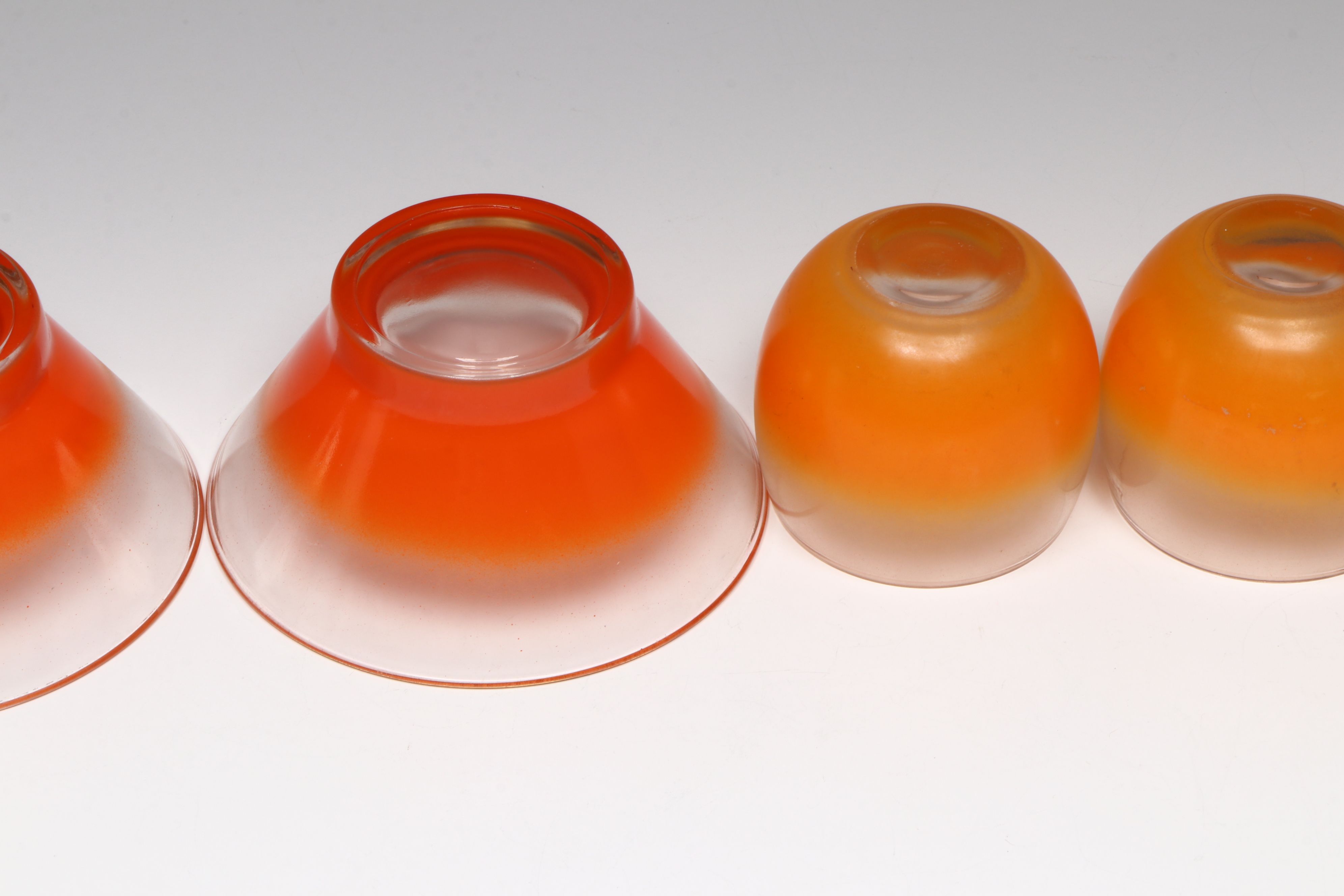 Mid Century Modern Orange Glass Bowls with Cocktail Glasses and Other Tableware